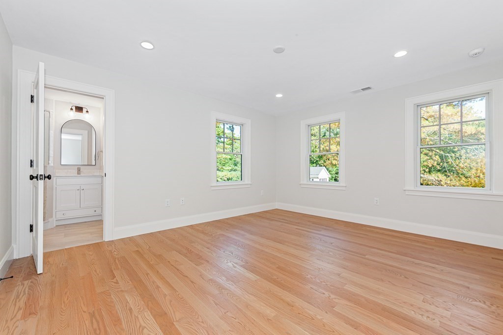 37 Woodland Road Lexington, MA 02420 - Photo 31 of 40 wooden floor in an empty room with a window