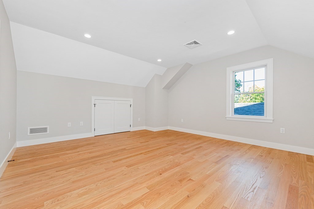 37 Woodland Road Lexington, MA 02420 - Photo 33 of 40 wooden floor in an empty room with a window