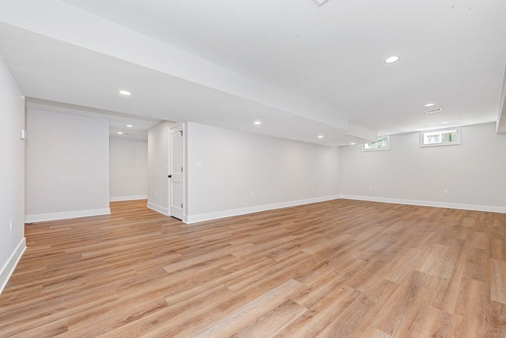 37 Woodland Road Lexington, MA 02420 - Photo 34 of 40 a view of empty room with wooden floor