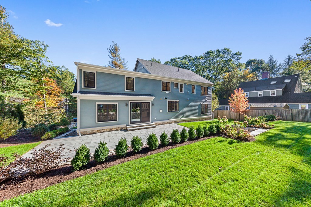 37 Woodland Road Lexington, MA 02420 - Photo 38 of 40 a front view of a house with a yard