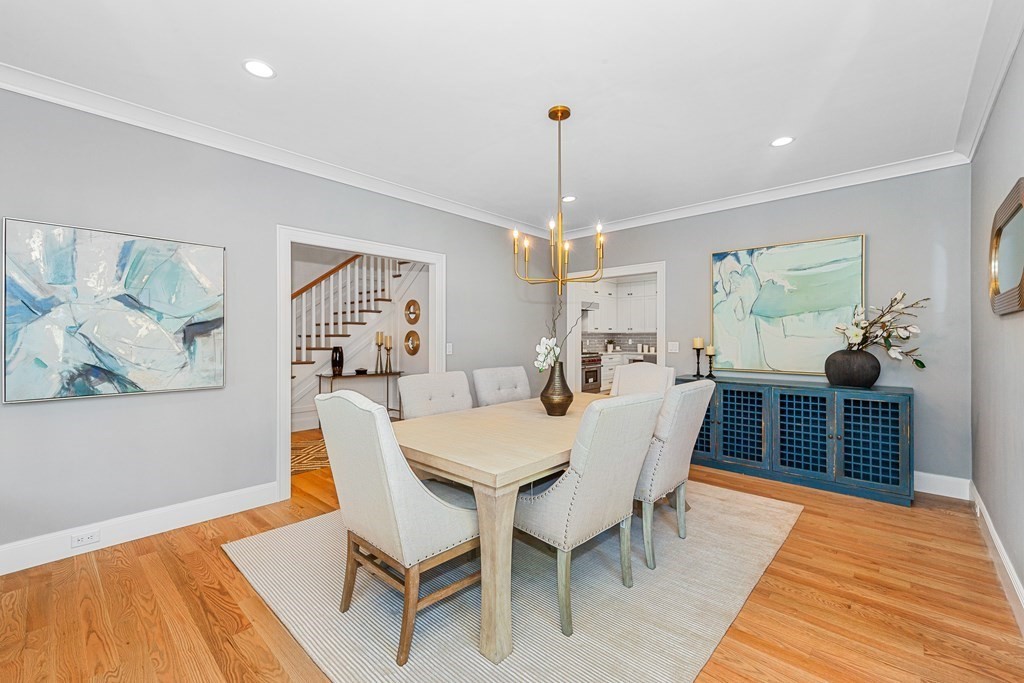 37 Woodland Road Lexington, MA 02420 - Photo 8 of 40 a view of a dining room with furniture window and wooden floor