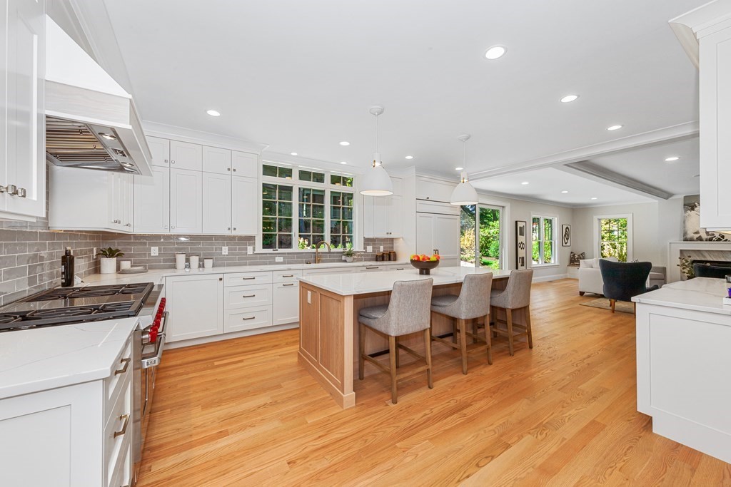 37 Woodland Road Lexington, MA 02420 - Photo 9 of 40 a kitchen with a sink cabinets and wooden floor