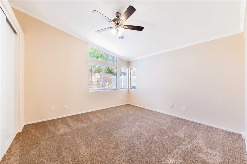 40048 Villa Venecia Temecula, CA 92591 - Photo 14 of 36 an empty room with windows and fan