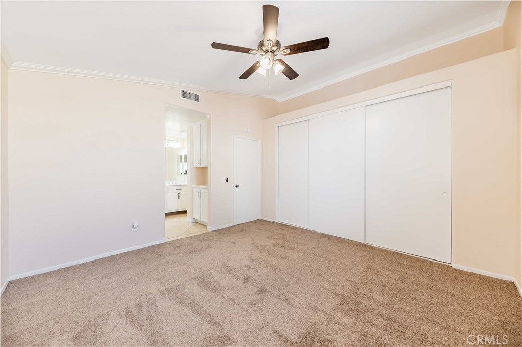 40048 Villa Venecia Temecula, CA 92591 - Photo 15 of 36 an empty room with a ceiling fan and window