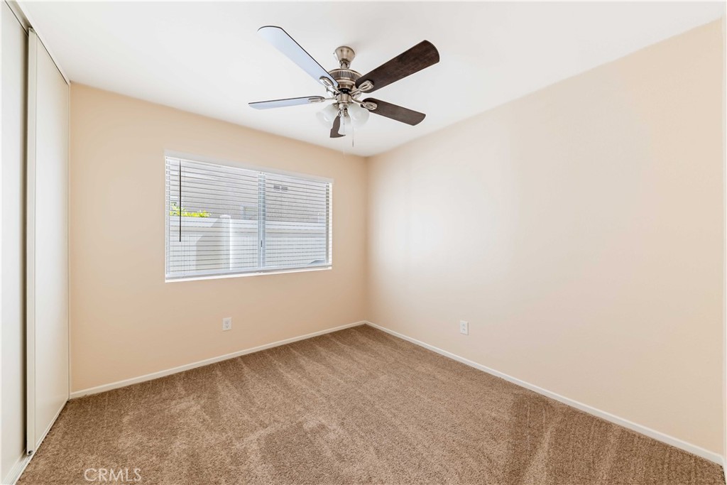 40048 Villa Venecia Temecula, CA 92591 - Photo 18 of 36 an empty room with windows and fan