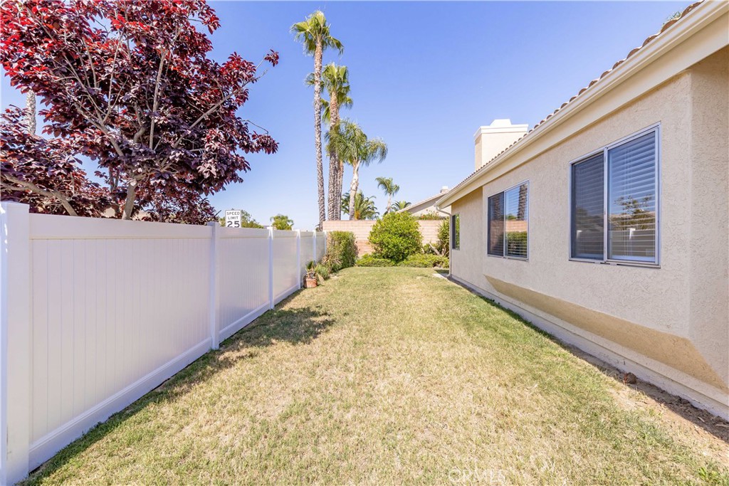 40048 Villa Venecia Temecula, CA 92591 - Photo 26 of 36 a view of a backyard with a large tree