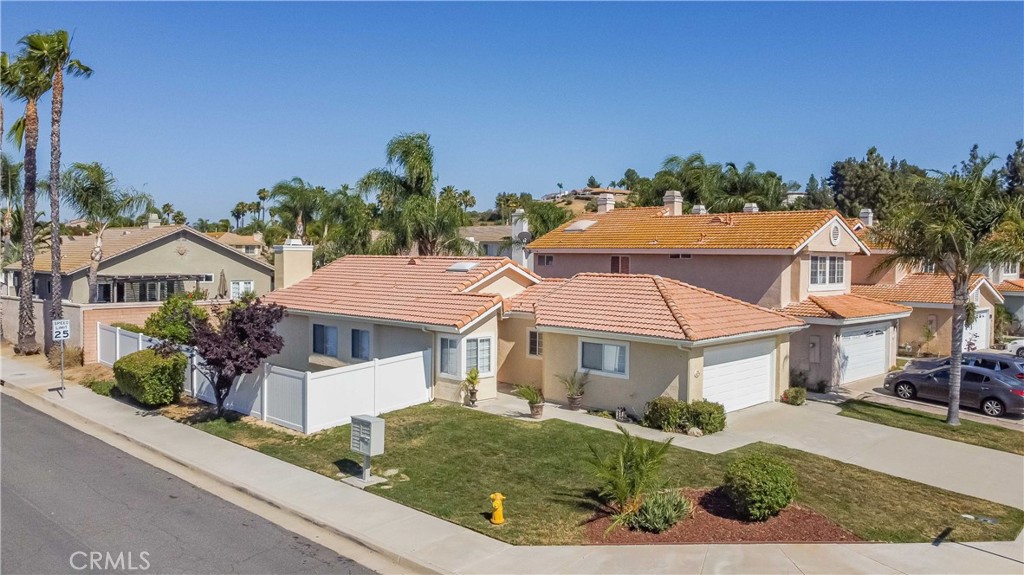 40048 Villa Venecia Temecula, CA 92591 - Photo 28 of 36 front view of a house with a yard