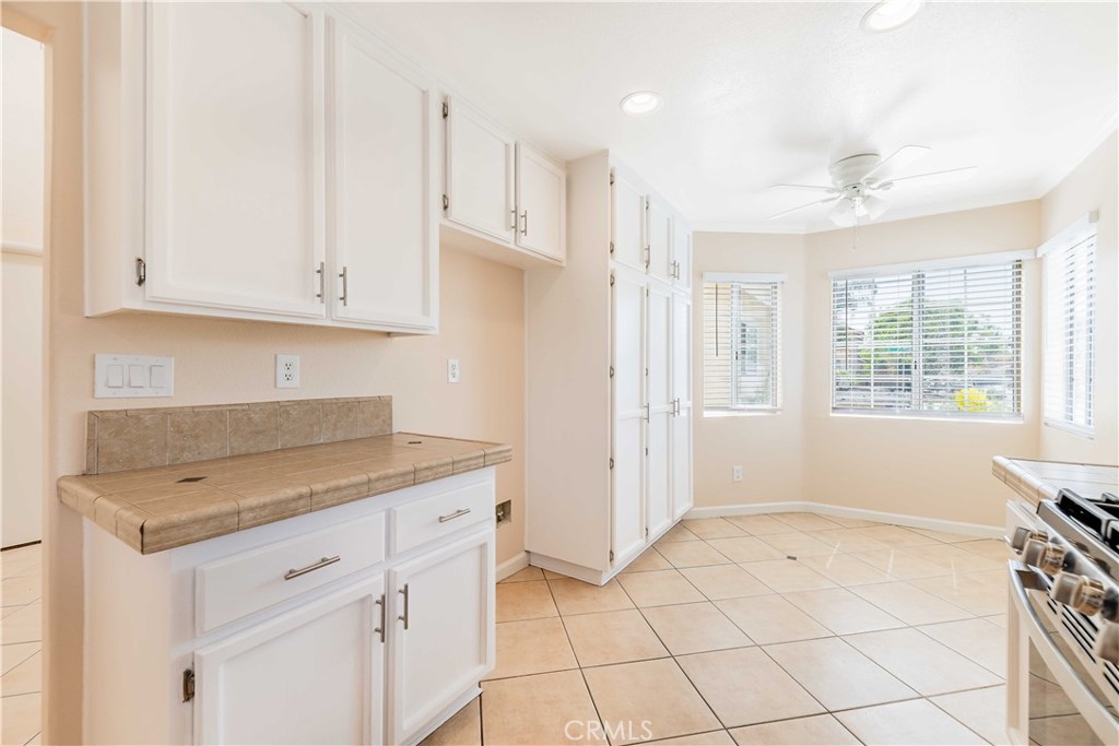 40048 Villa Venecia Temecula, CA 92591 - Photo 7 of 36 a view of kitchen with granite countertop cabinets
