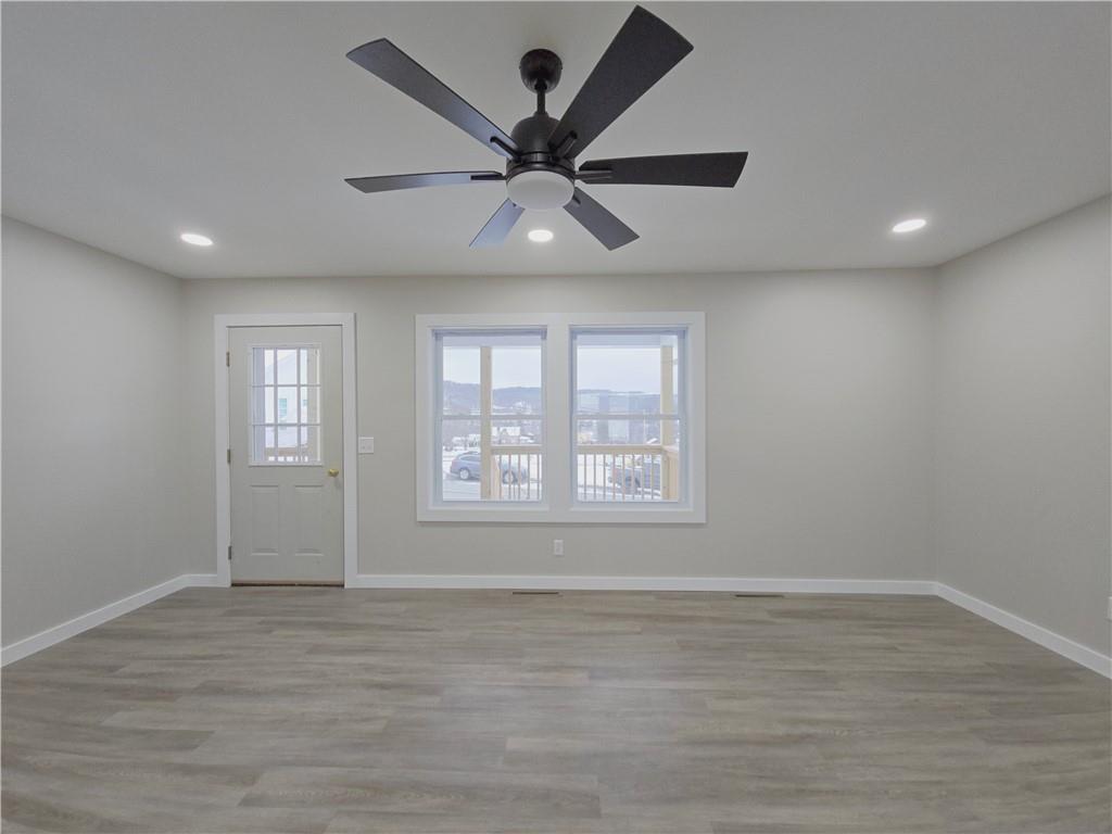 4161 Maple Street Hawthorn, PA 16230 - Photo 13 of 27 a view of an empty room with wooden floor and a window