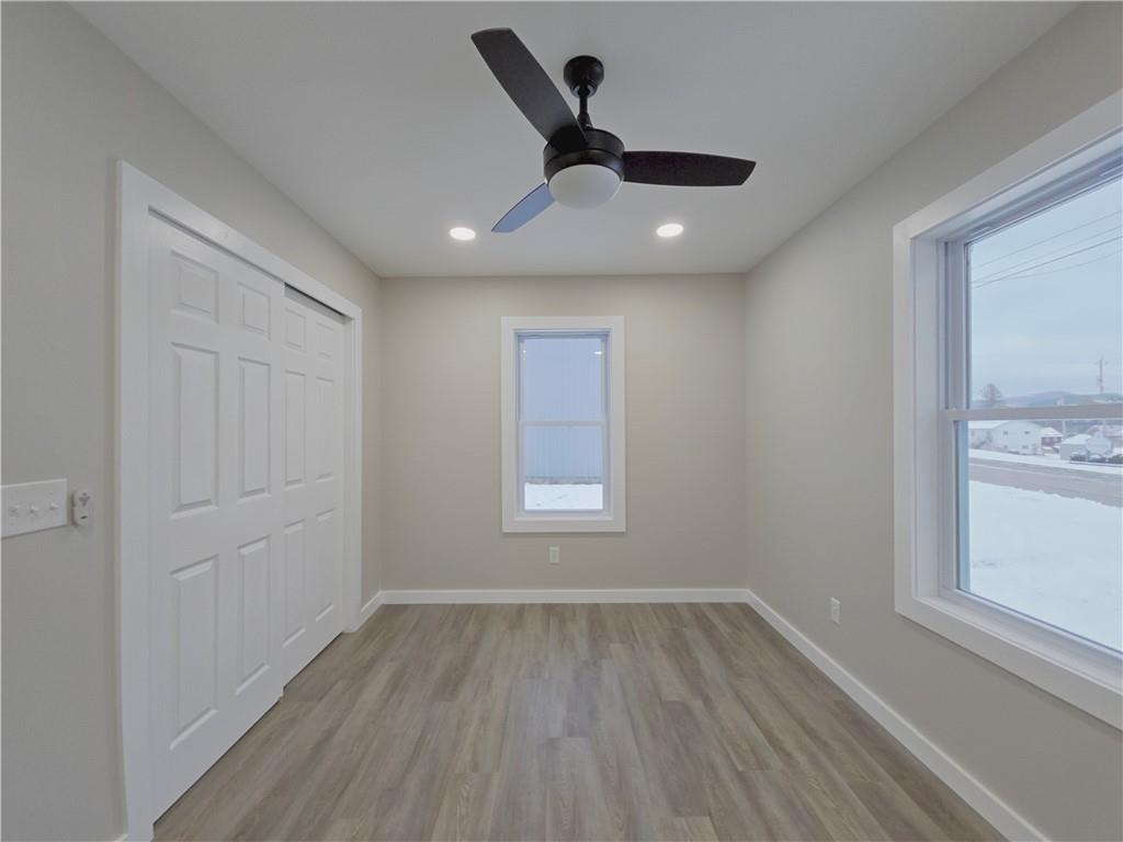 4161 Maple Street Hawthorn, PA 16230 - Photo 16 of 27 a view of empty room with wooden floor and fan