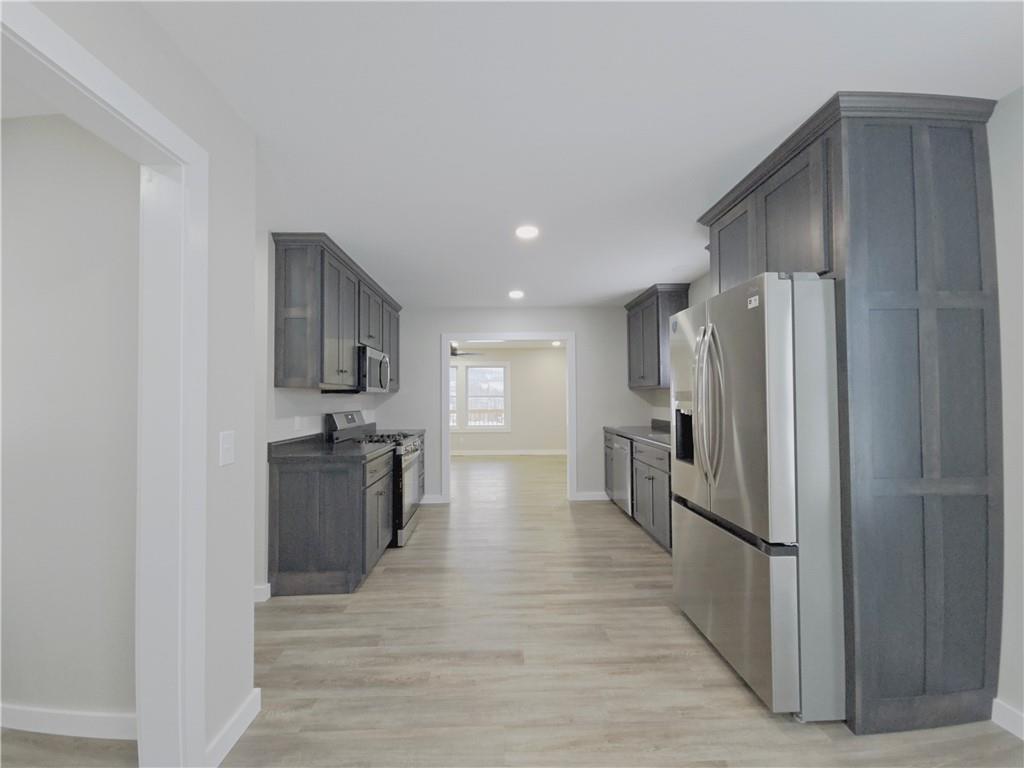 4161 Maple Street Hawthorn, PA 16230 - Photo 8 of 27 a kitchen with stainless steel appliances granite countertop a refrigerator stove and oven