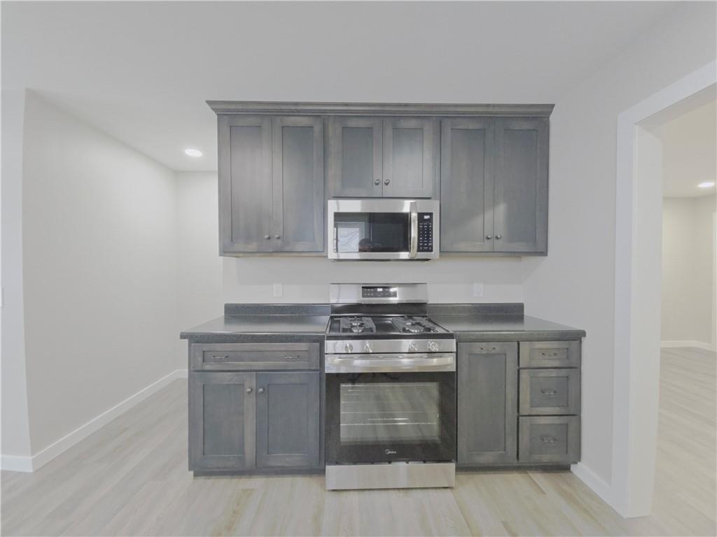 4161 Maple Street Hawthorn, PA 16230 - Photo 10 of 27 a kitchen with a stove and a microwave