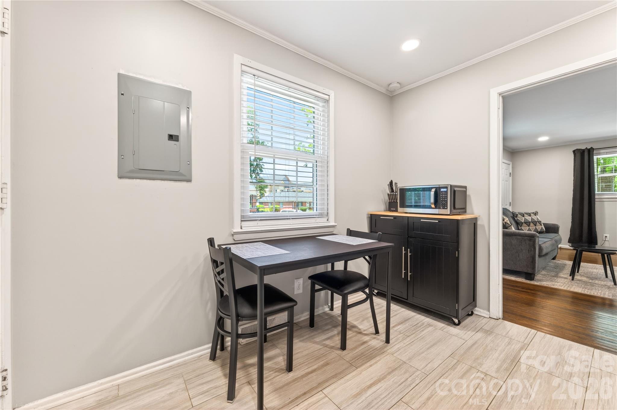 3241 Minnesota Road Charlotte, NC 28208 - Photo 11 of 18 a view of a workspace with furniture and a window