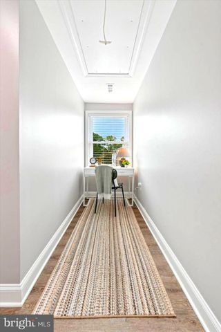 a view of a room with wooden floor