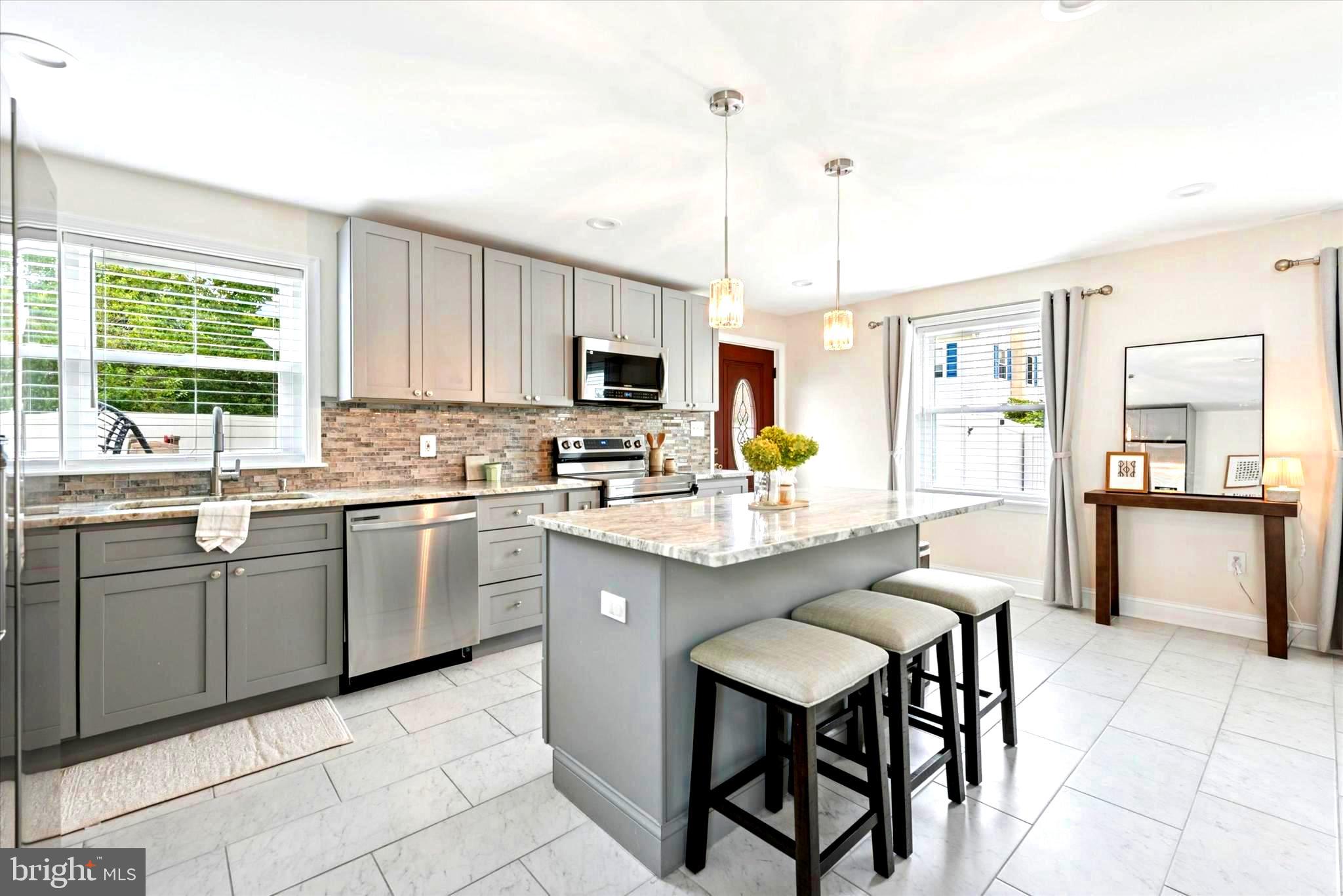 726 Brookhaven Road Wallingford, PA 19086 - Photo 4 of 30 conversational meal prep at the island