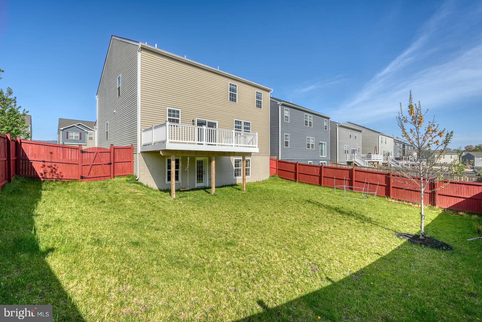 2085 Pomona Way Frederick, MD 21702 - Photo 50 of 53 Spacious backyard with vibrant greenery.