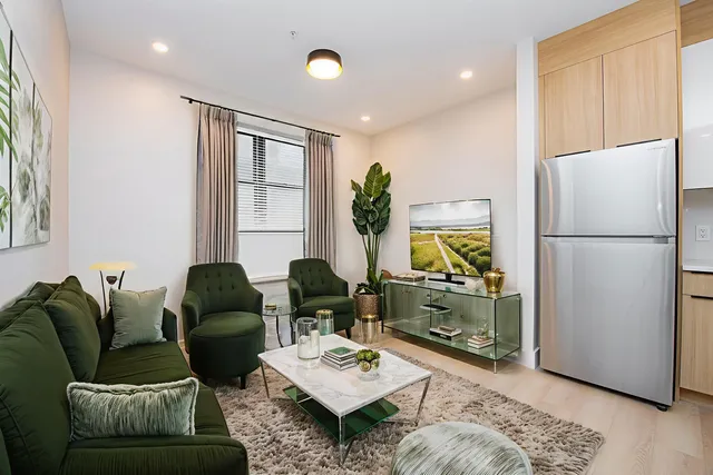 a living room with furniture and a window