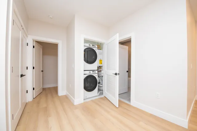 a view of a hallway with washer and dryer