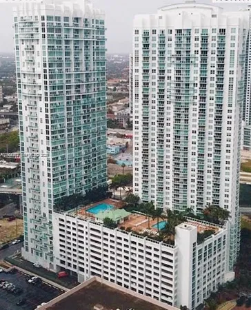 a view of a balcony with a couple of buildings