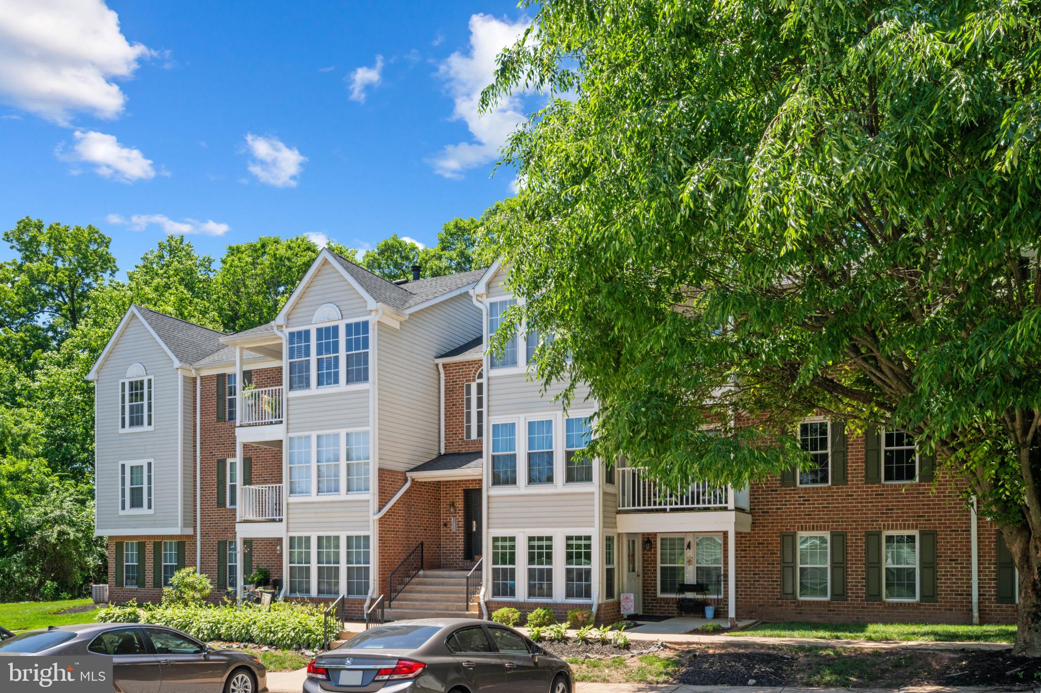3105 Cardinal Way, Unit L Abingdon, MD 21009 - Photo 28 of 31 a front view of a residential apartment building with a yard