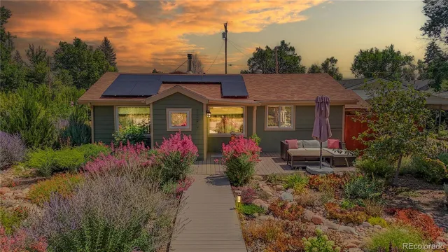 a front view of a house with yard and green space