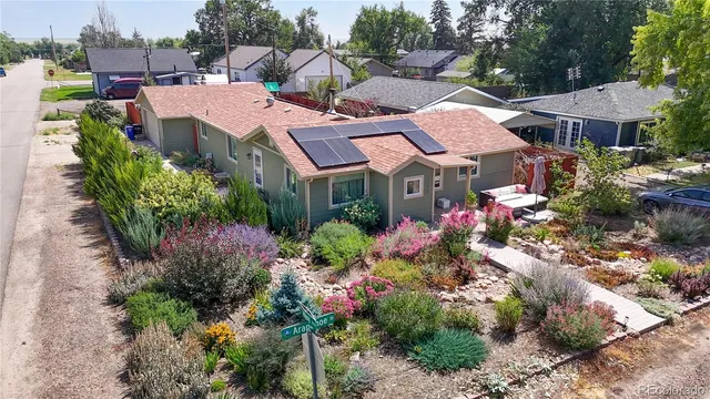 a view of a and patio with table and chairs and potted plants