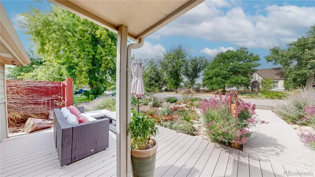 a view of a backyard with sitting area