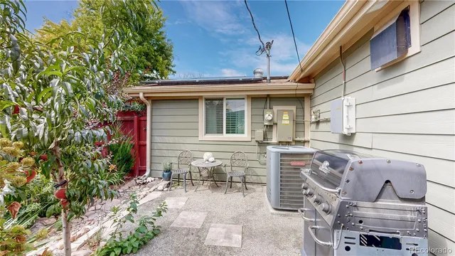 a front view of a house with outdoor seating