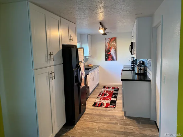 a room with furniture and wooden floor