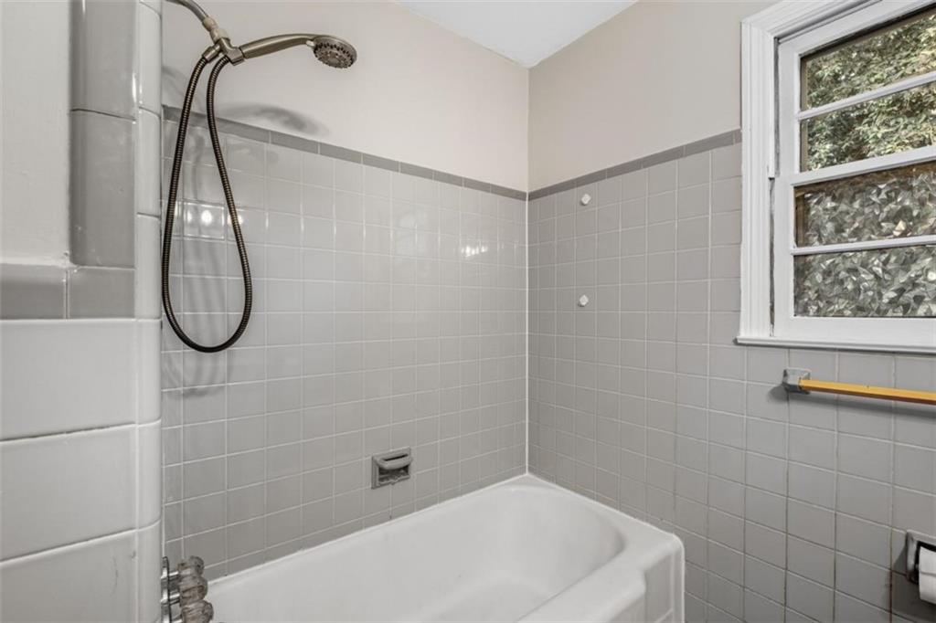 14 Mitchell Circle Southeast Rome, GA 30161 - Photo 21 of 39 a bathroom with a bath tub with a shower