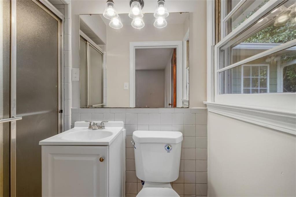 14 Mitchell Circle Southeast Rome, GA 30161 - Photo 22 of 39 a bathroom with a sink a toilet and mirror