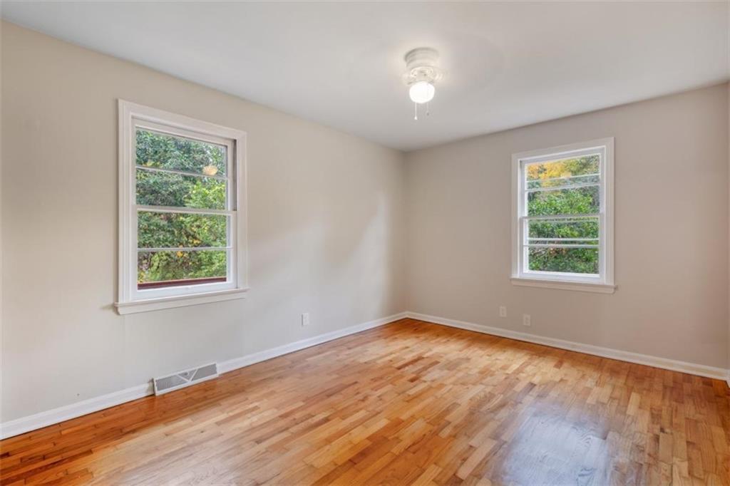 14 Mitchell Circle Southeast Rome, GA 30161 - Photo 31 of 39 a view of an empty room with wooden floor and a window