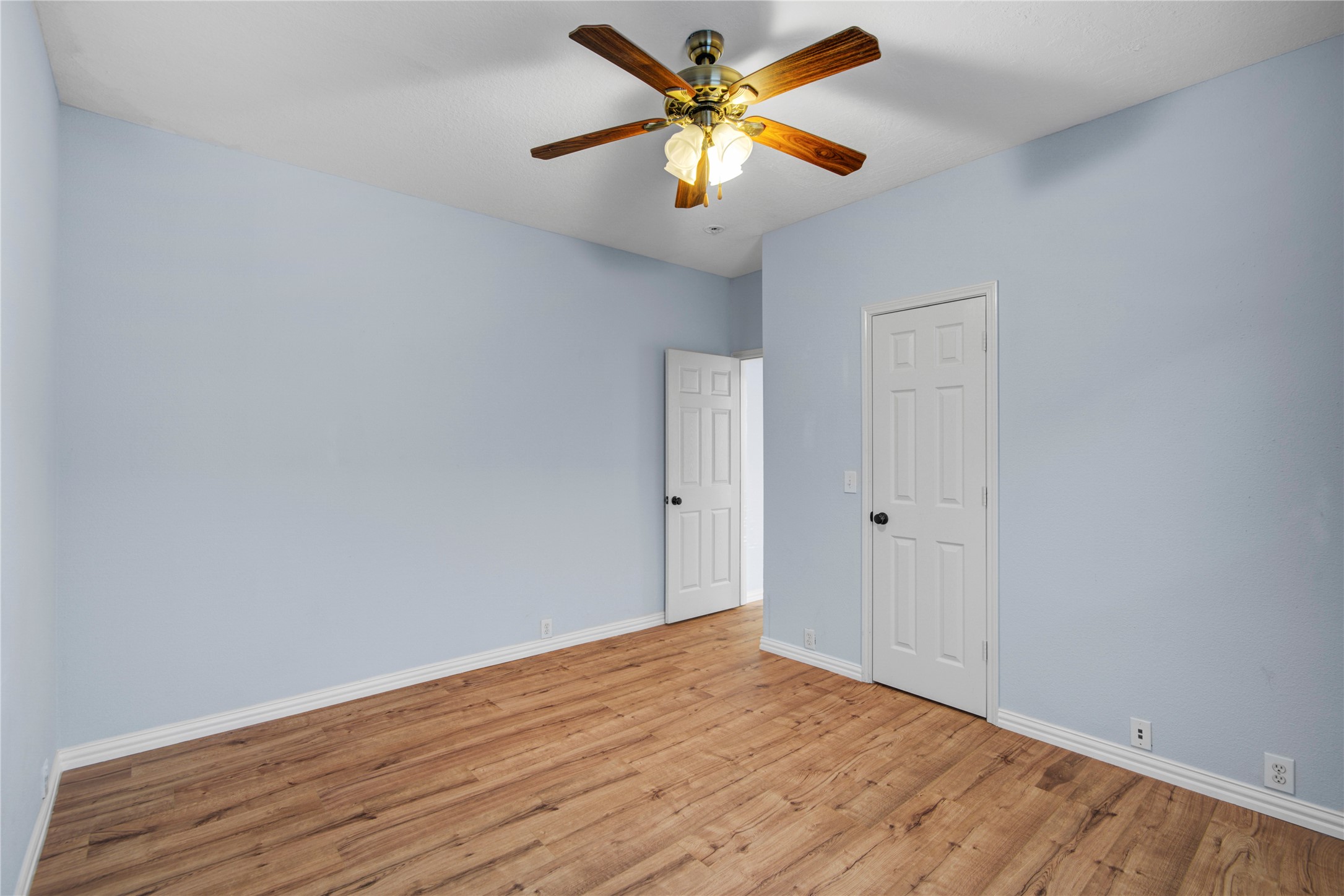 2206 Louetta Brook Lane Spring, TX 77388 - Photo 12 of 39 a view of a room with wooden floor and a ceiling fan
