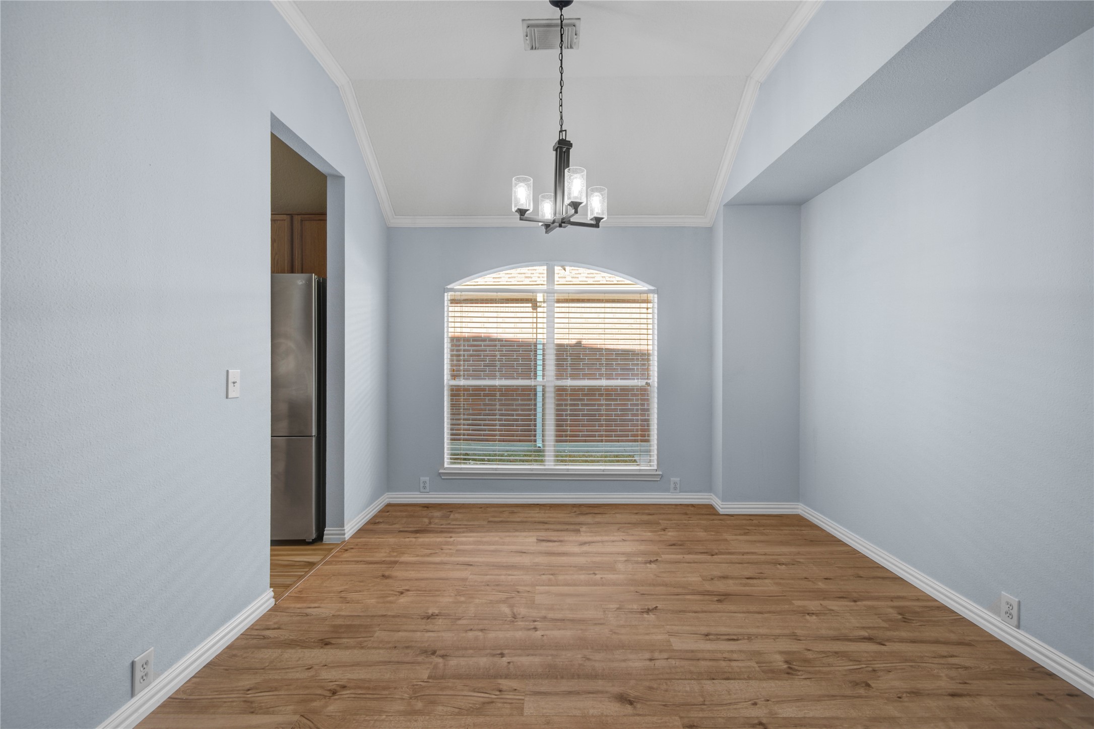 2206 Louetta Brook Lane Spring, TX 77388 - Photo 18 of 39 an empty room with wooden floor and windows