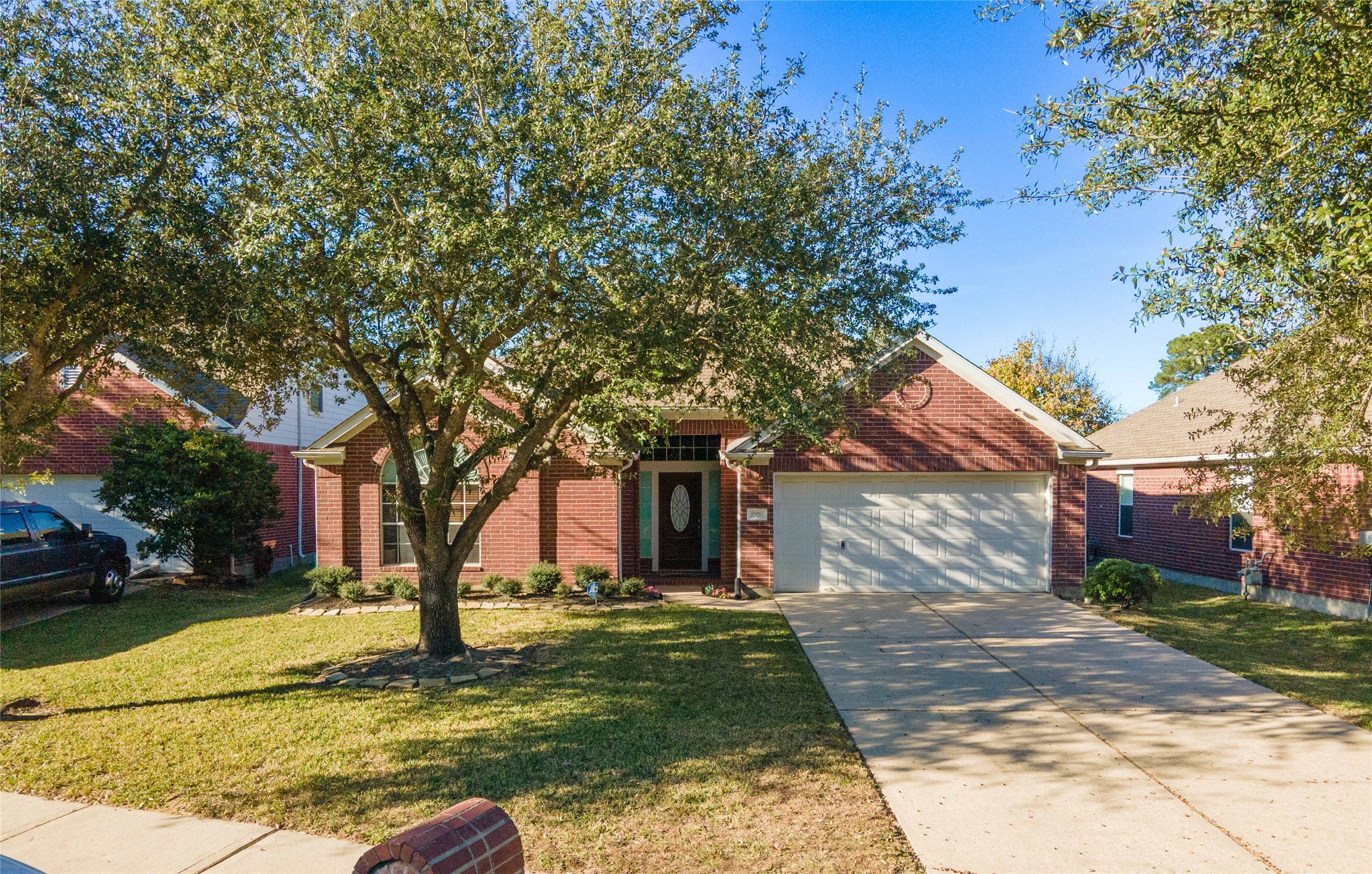 2206 Louetta Brook Lane Spring, TX 77388 - Photo 2 of 39 a view of a yard with plants and a tree