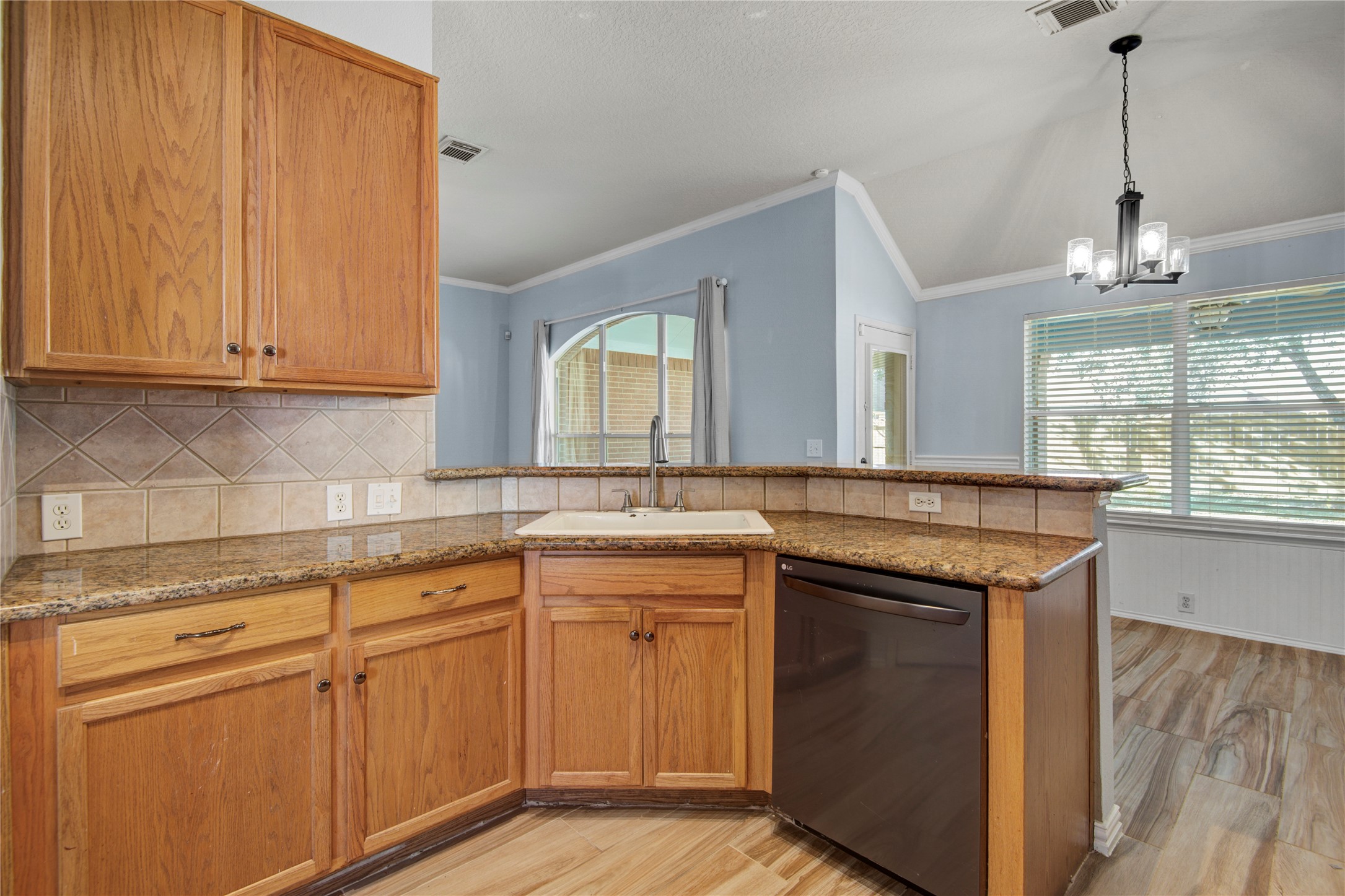 2206 Louetta Brook Lane Spring, TX 77388 - Photo 22 of 39 a kitchen with cabinets and window
