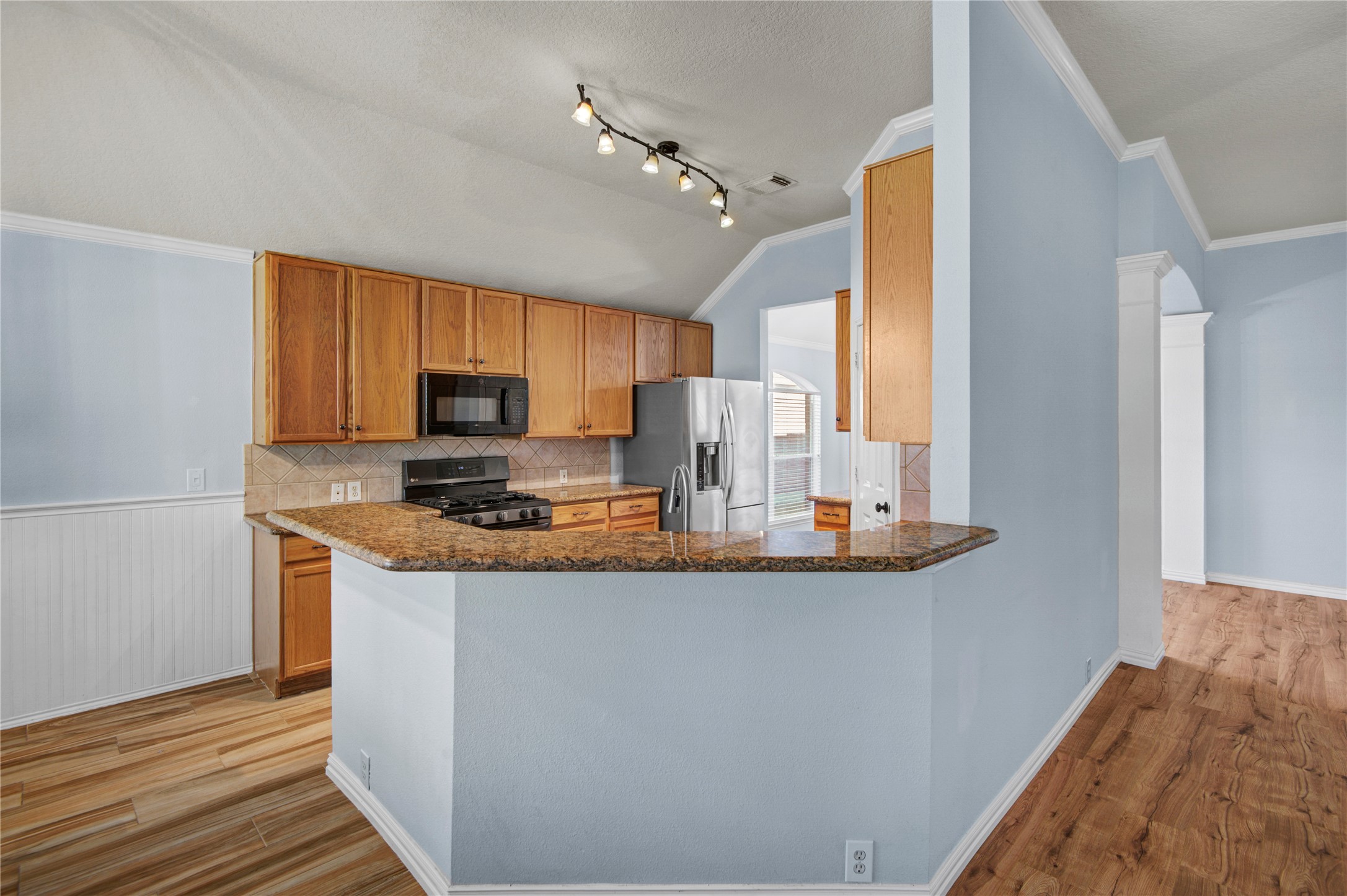 2206 Louetta Brook Lane Spring, TX 77388 - Photo 25 of 39 a kitchen with stainless steel appliances granite countertop a stove a sink and a refrigerator