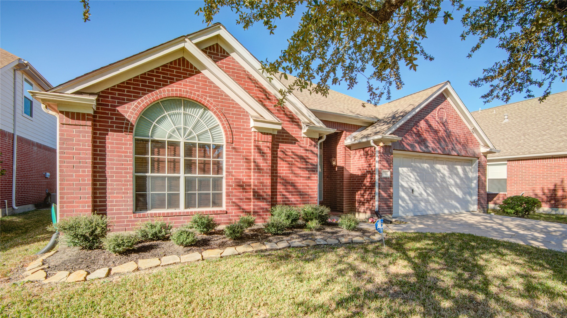 2206 Louetta Brook Lane Spring, TX 77388 - Photo 3 of 39 a front view of a house with garden
