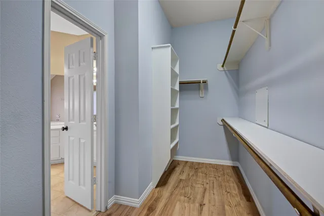 a view of hallway with wooden floor