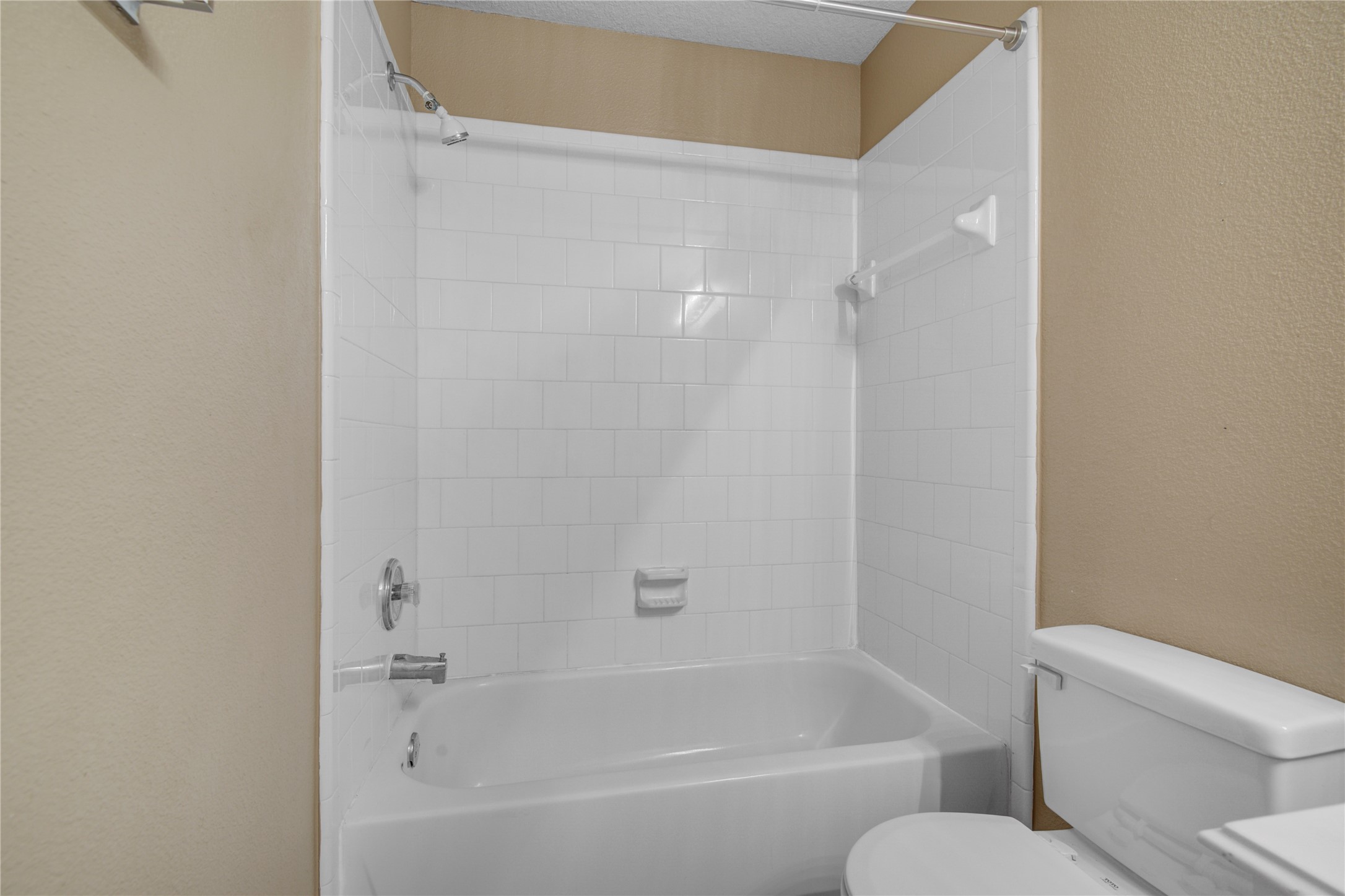 2206 Louetta Brook Lane Spring, TX 77388 - Photo 10 of 39 a white bath tub sitting next to a white toilet and vanity