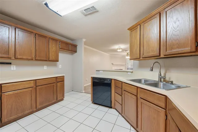 a kitchen with stainless steel appliances granite countertop a sink and cabinets