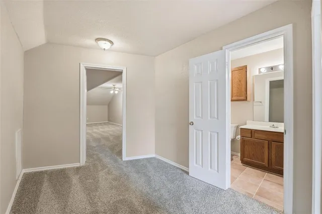 an empty room with mirror in it