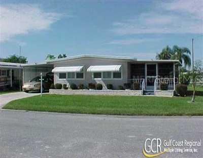 1211 45th Avenue East Ellenton, FL 34222 - Photo 1 of 1 a front view of house with a garden