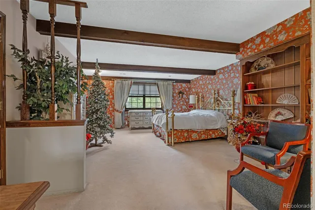 a bedroom with furniture and a potted plant