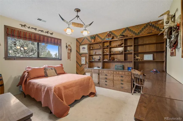 a bedroom with a bed and furniture