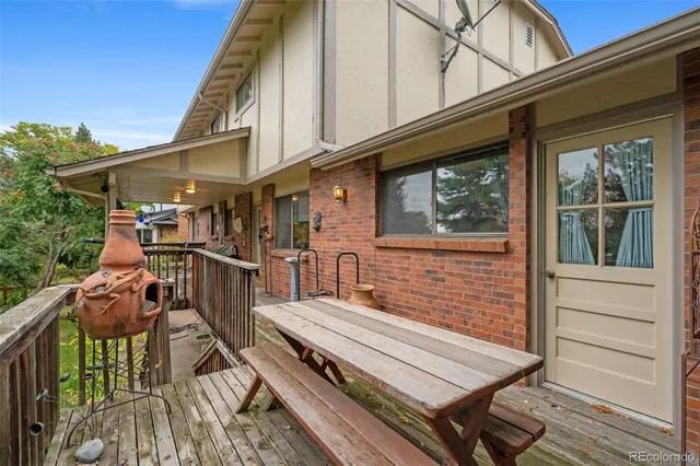 a view of a chairs and table in the balcony