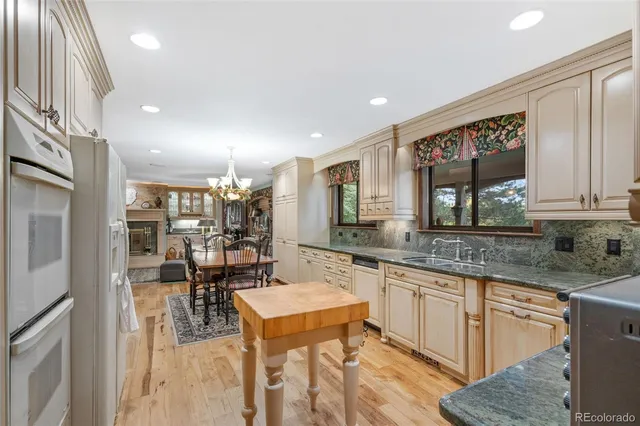 a kitchen with a sink cabinets and window