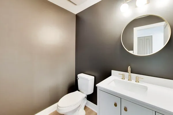 a bathroom with a toilet and sink