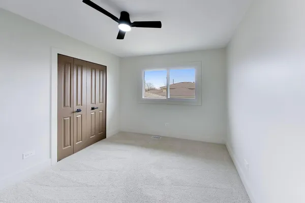 an empty room with a empty space and windows