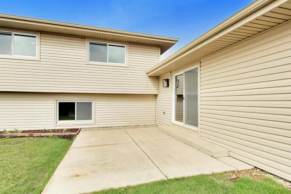 a view of a house with a yard and garage